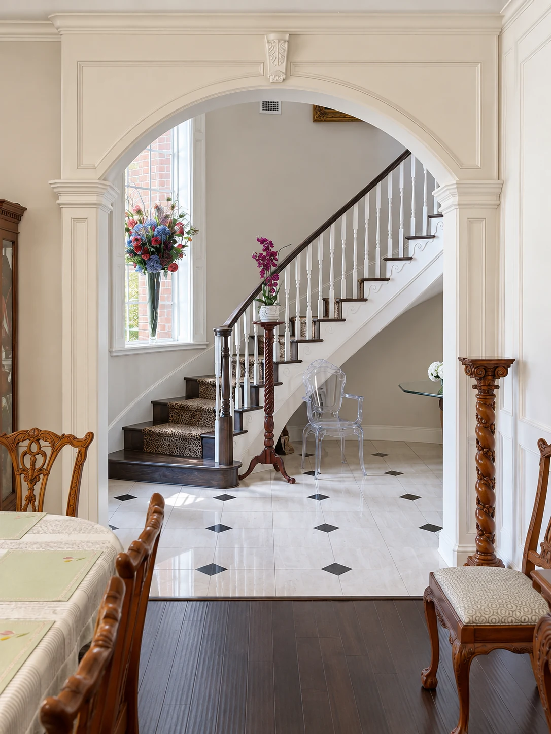 Interior arch framing a view toward a staircase