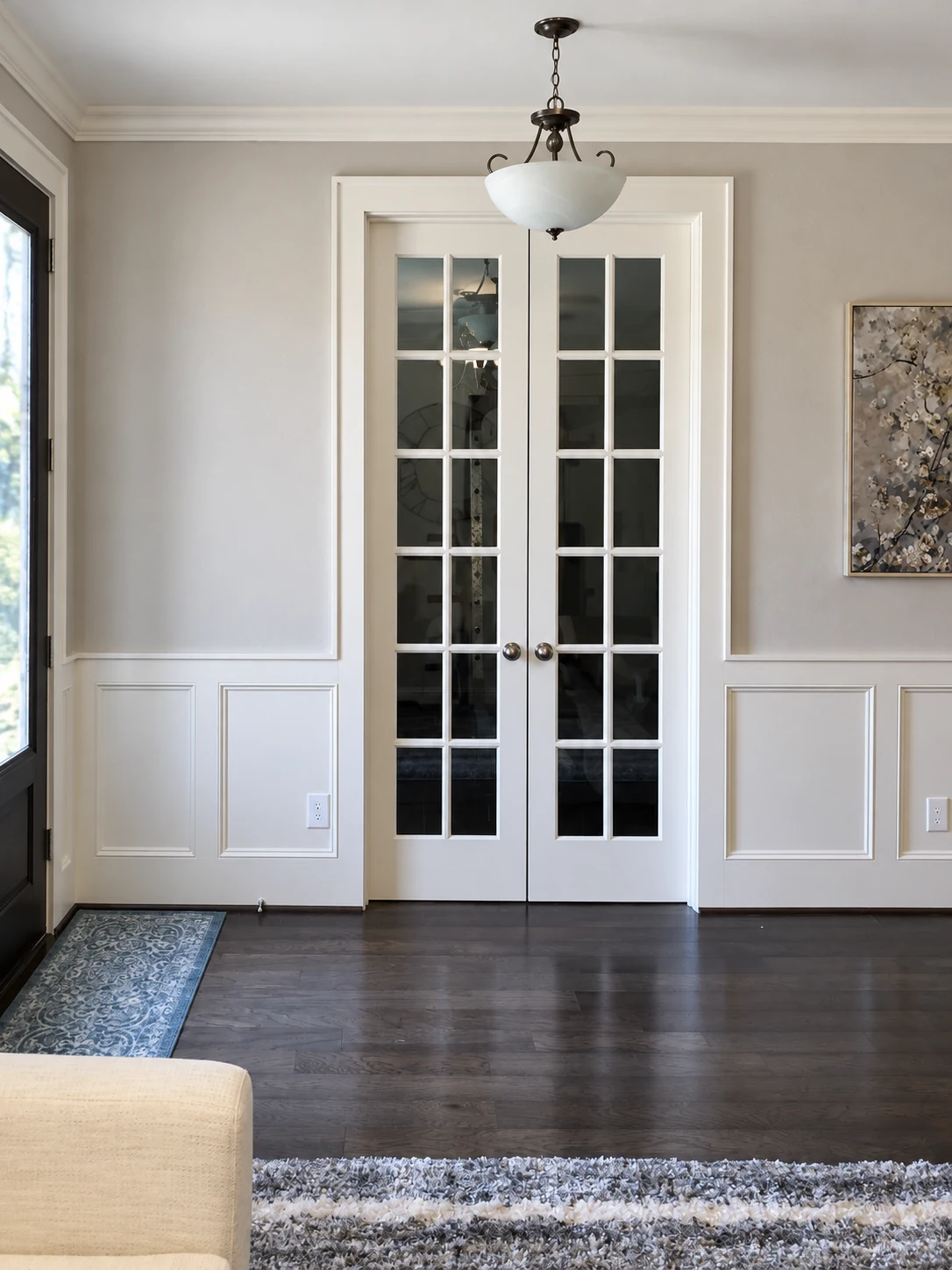 Pair of French doors set within paneled walls